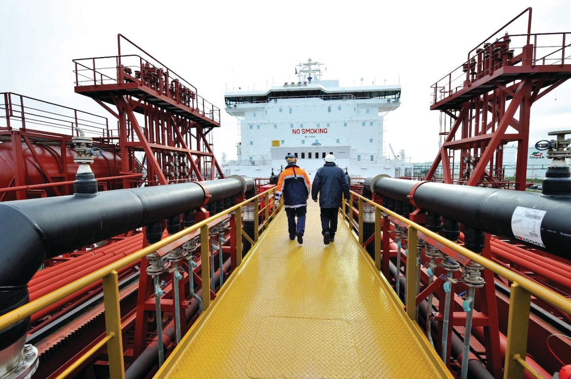 Shell employee walking along on a tanker 