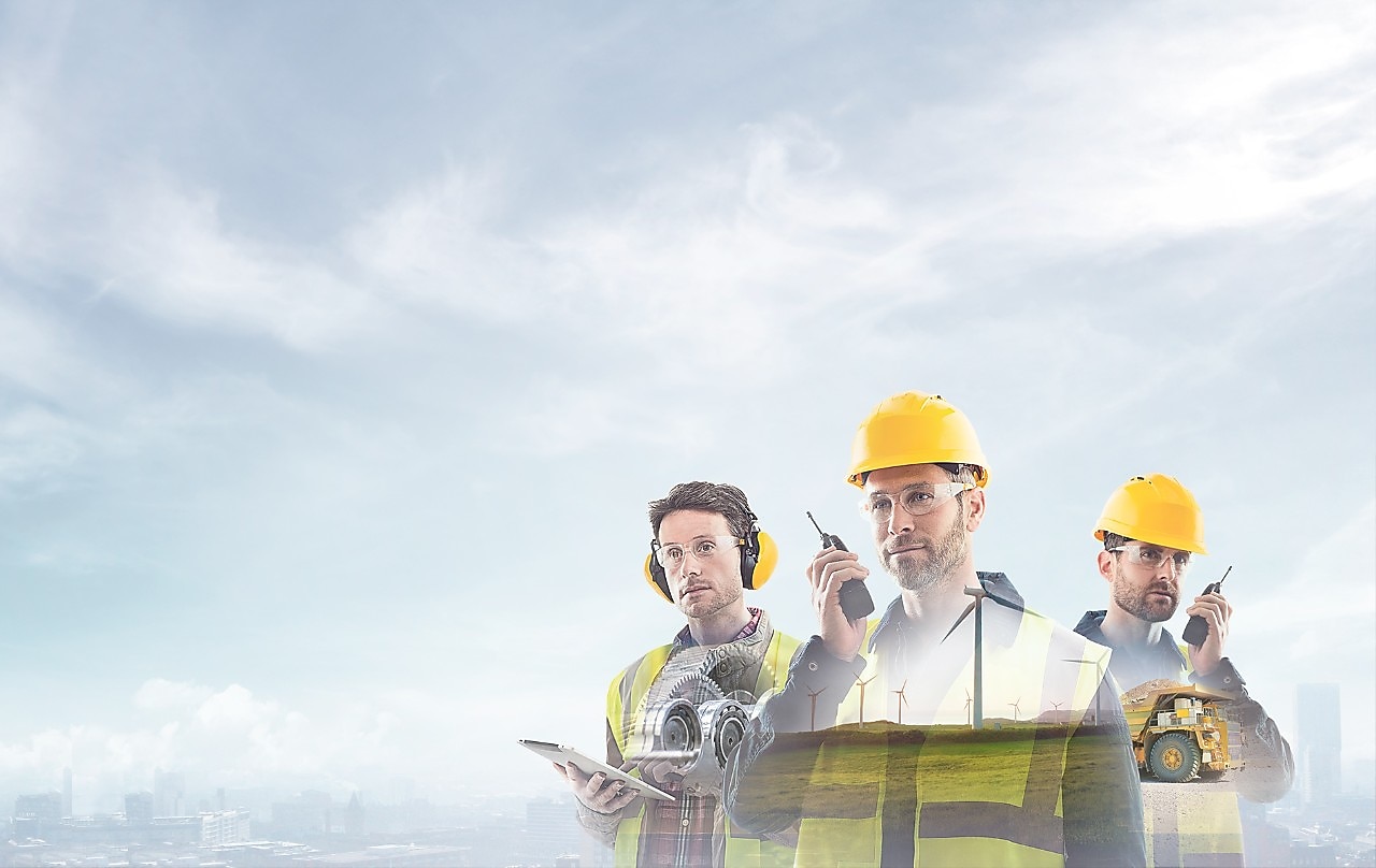  three workers on radios and reading documents, transposed over a background of blue sky with light clouds