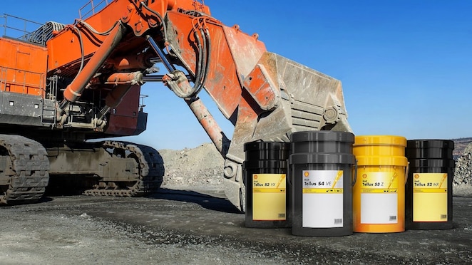 Yellow digger and construction worker